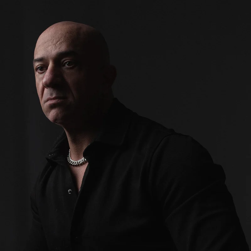 Akmal Kadri in a dark cinematic studio portrait